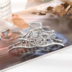 Silvery hollow spiderweb style Halloween hair claw clip with strong grip