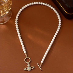 Elegant Faux Pearl Necklace with Flower and Rhinestone Planet Pendant.