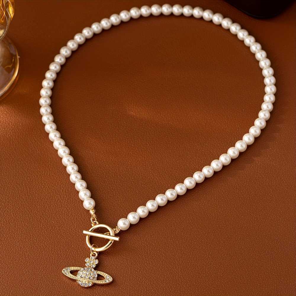Elegant Faux Pearl Necklace with Flower and Rhinestone Planet Pendant.