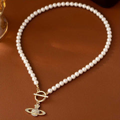 Elegant Faux Pearl Necklace with Flower and Rhinestone Planet Pendant.