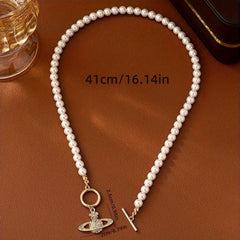 Elegant Faux Pearl Necklace with Flower and Rhinestone Planet Pendant.