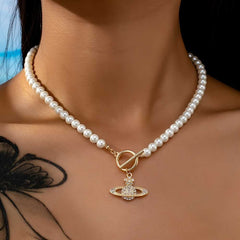 Elegant Faux Pearl Necklace with Flower and Rhinestone Planet Pendant.