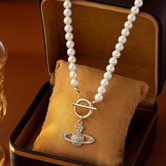 Elegant Faux Pearl Necklace with Flower and Rhinestone Planet Pendant.